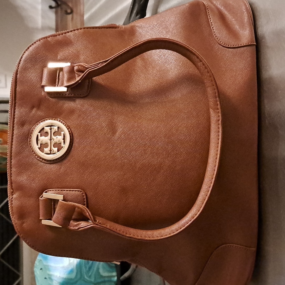 Nwt beautiful handbag in chestnut brown color. 15"×12 ". Vegan leather.